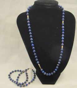 One stamped 14KT yellow gold lady's lapis beaded necklace and two bracelet set